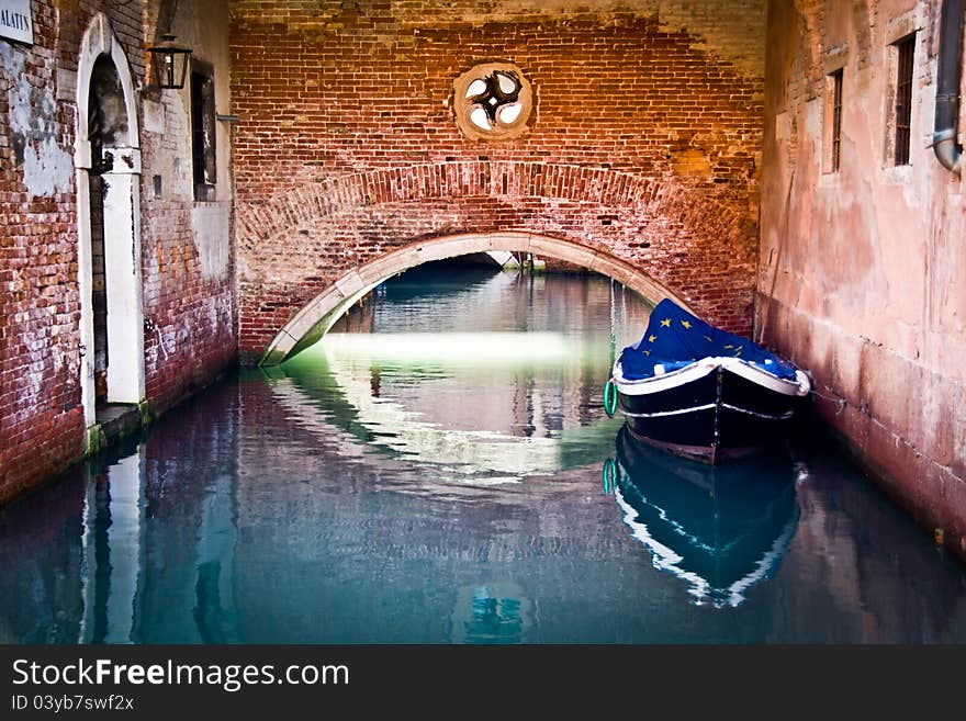 Europe flag covering a boat on water in venezia. Europe flag covering a boat on water in venezia