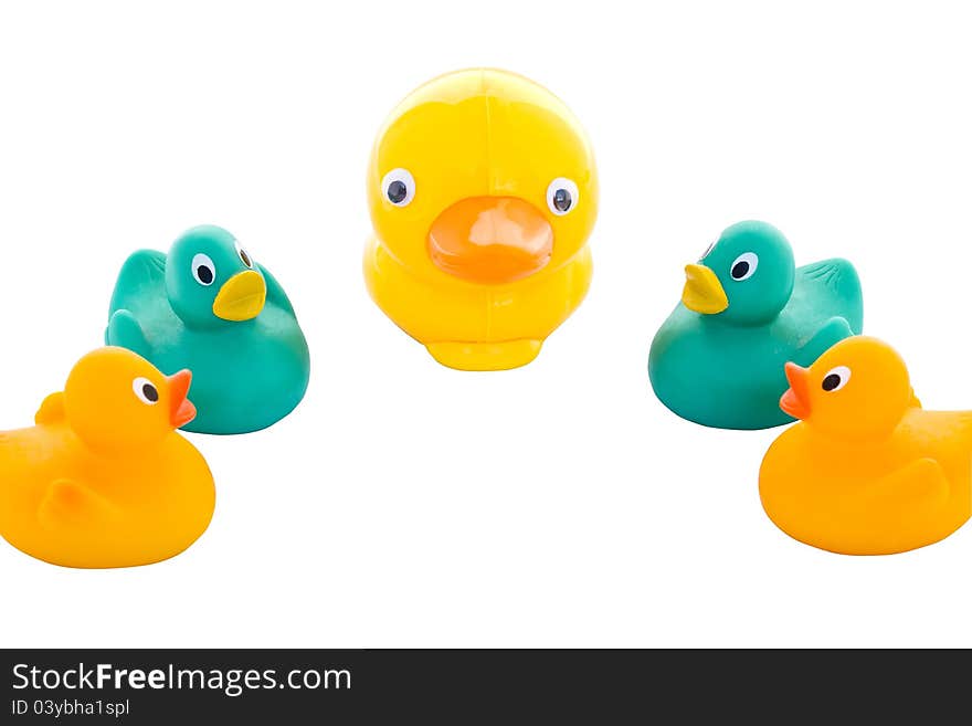 A family of yellow and green toy ducks.