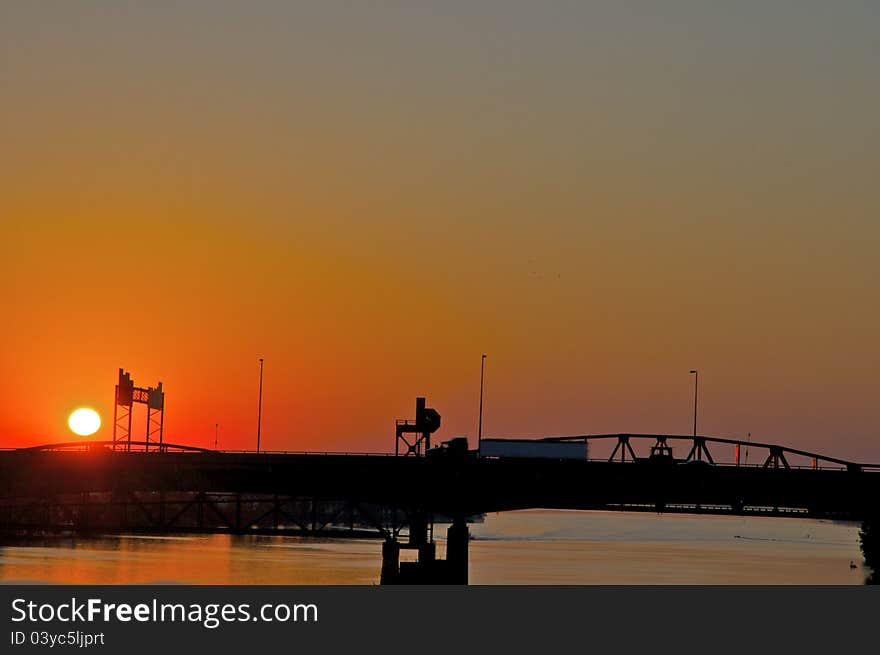 Sunrise over interstate highway bridge - Commerce. Sunrise over interstate highway bridge - Commerce