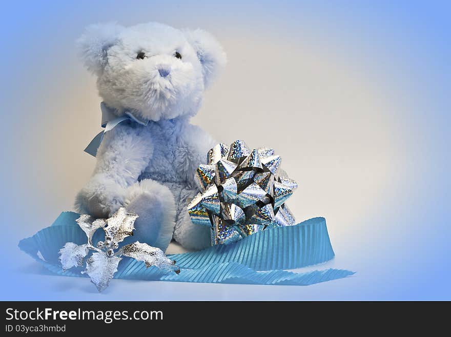 Blue teddy bear with bow and ribbon. Blue teddy bear with bow and ribbon.