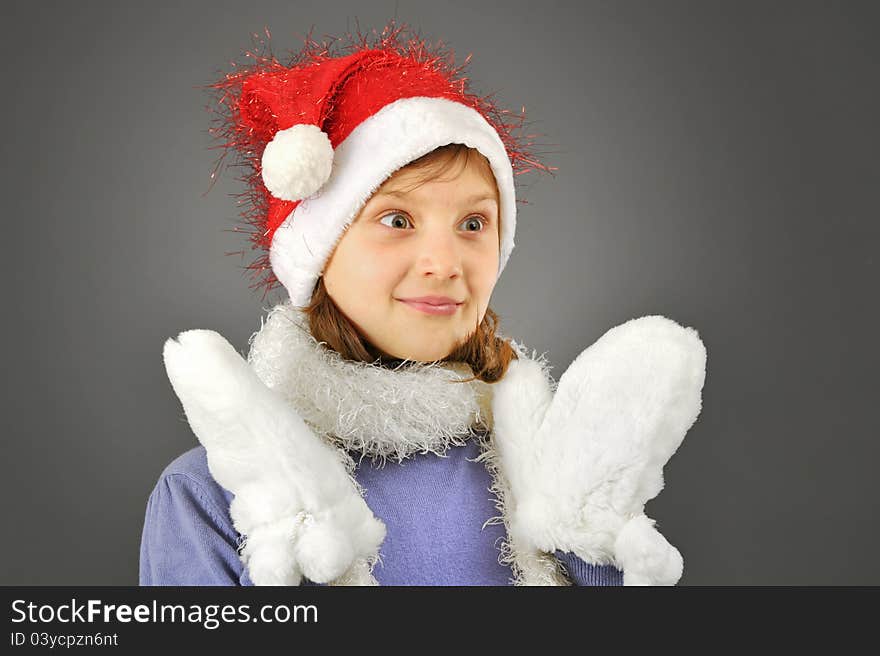 Surprised girl with santa hat isolated in studio. Surprised girl with santa hat isolated in studio