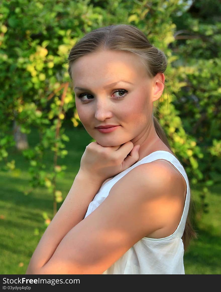 Beautiful young woman in the garden