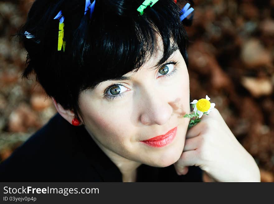 Pretty brunette woman with clothespins