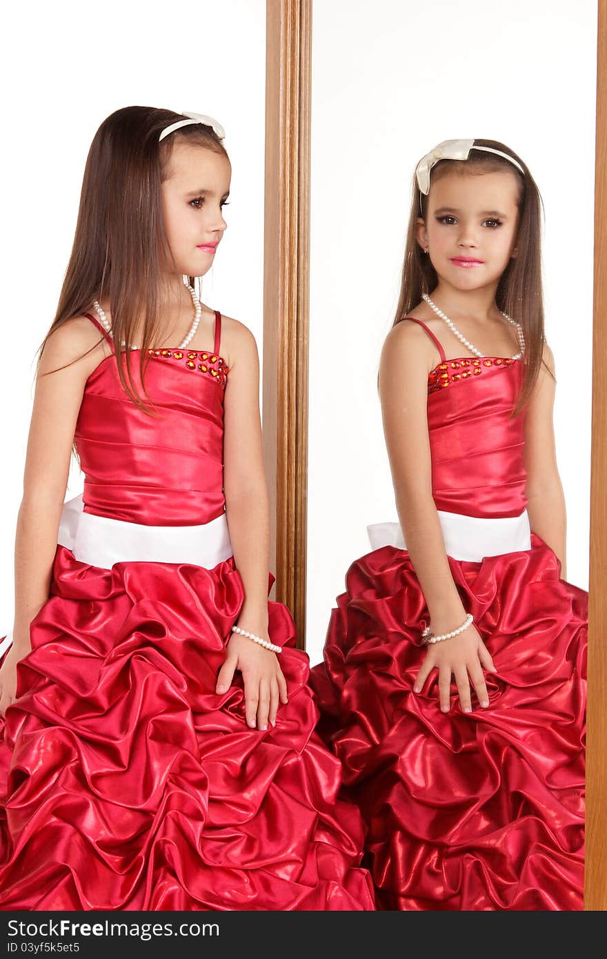 Beautiful little girl in red evening dress