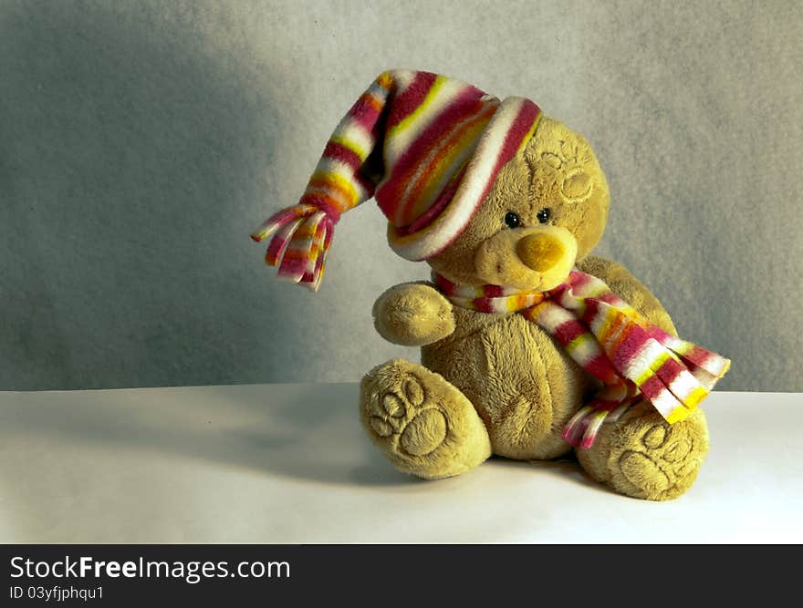 Teddy bear with hair and wool scarf