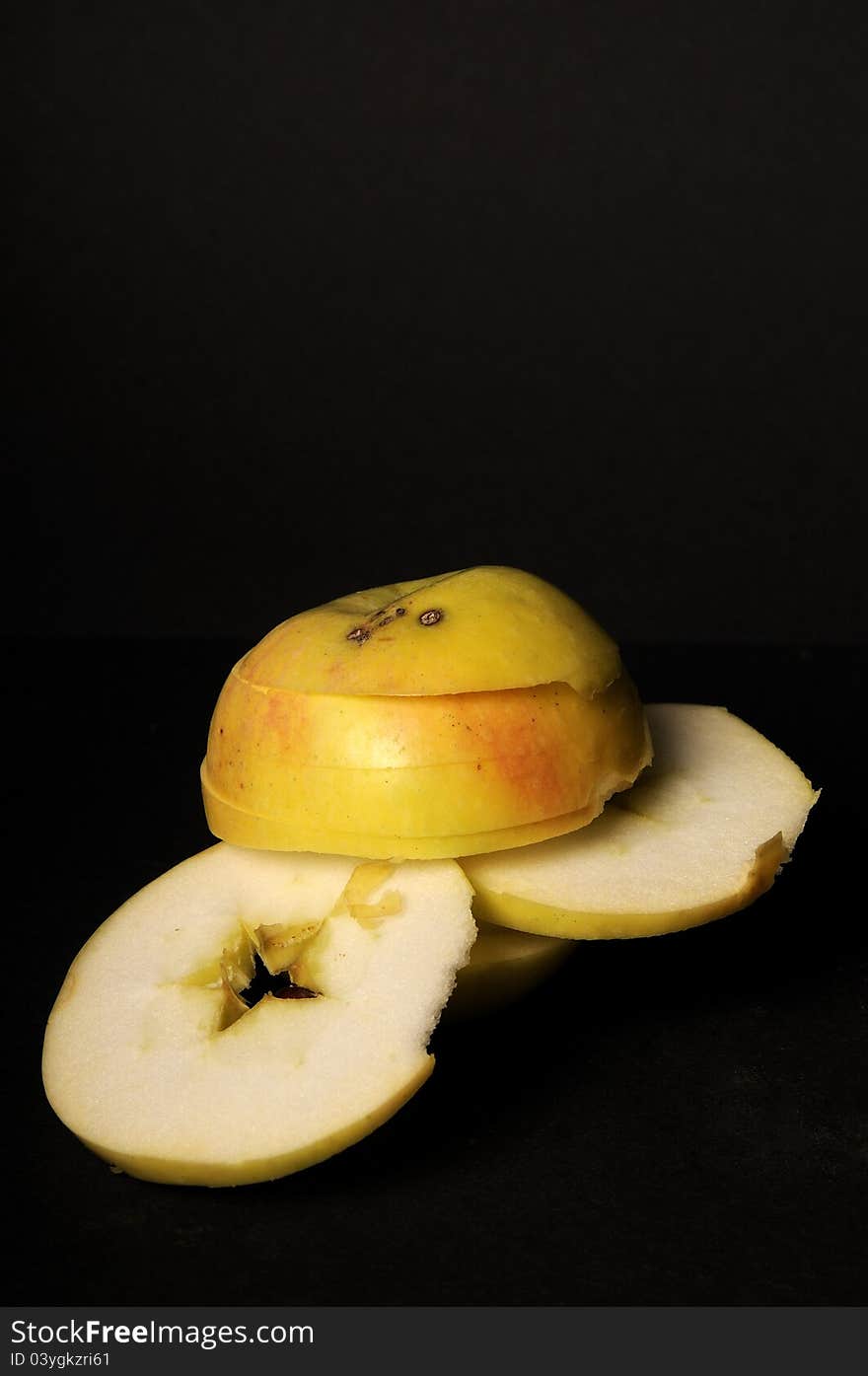 Closeup with sliced apple studio isolated on black background. Closeup with sliced apple studio isolated on black background