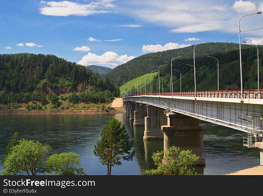 Bridge through mountain river