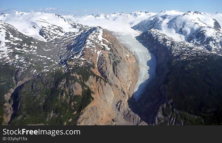 A view of a mountains, glaciers and vallies in the late summer. A view of a mountains, glaciers and vallies in the late summer