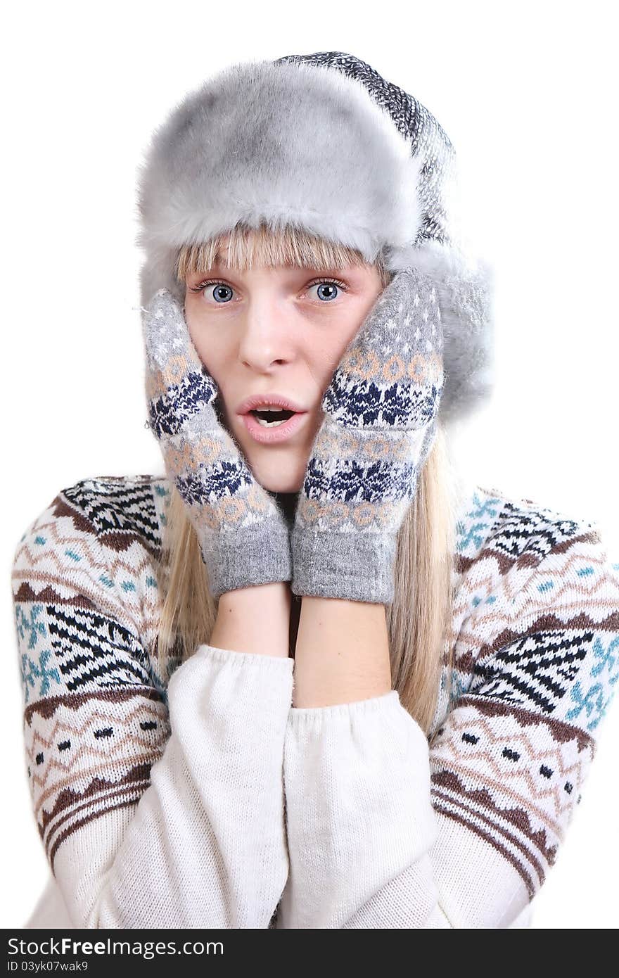 Surprised young woman in winter clothes