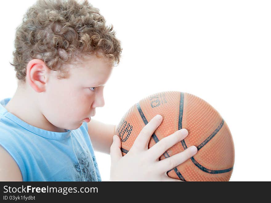 Boy with a basketball on a white background. Boy with a basketball on a white background