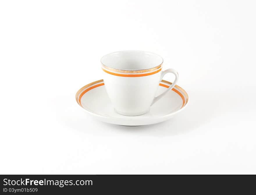 An old classic porcelain cup for tea or coffee isolated on white background.