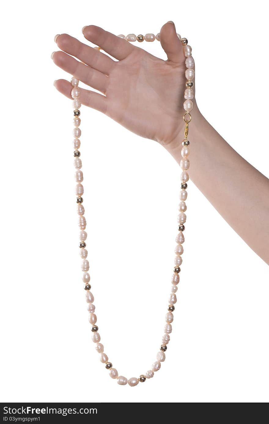 Necklace of pink pearls on hand