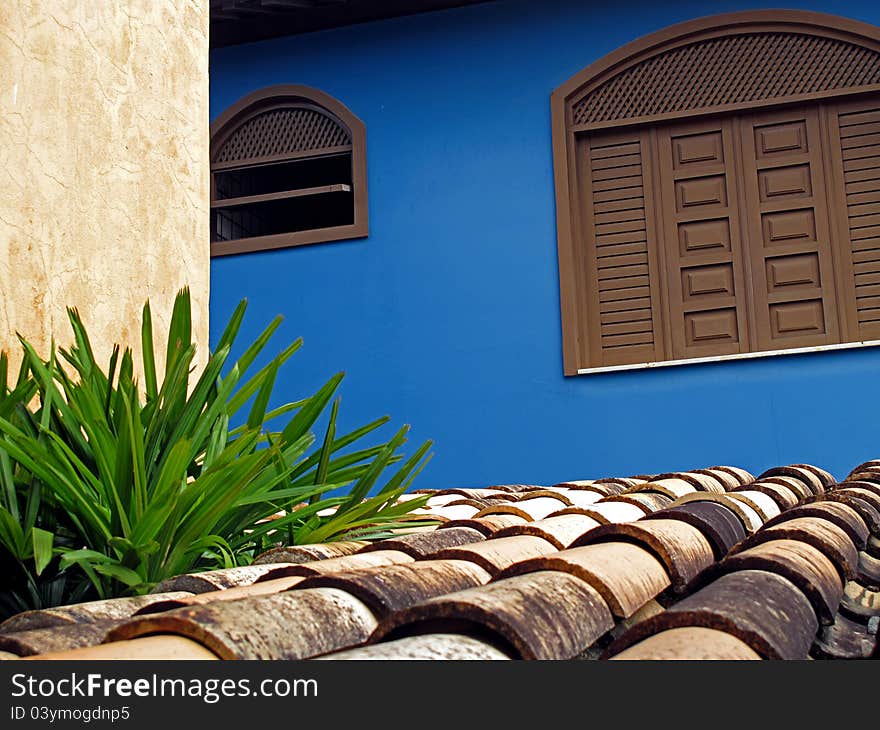 Blue wall with roof and window. Blue wall with roof and window