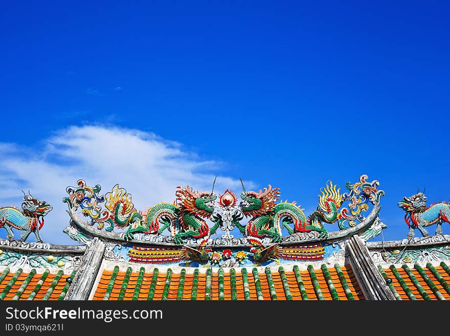 Beautiful twin dragon with blue sky and couple lion