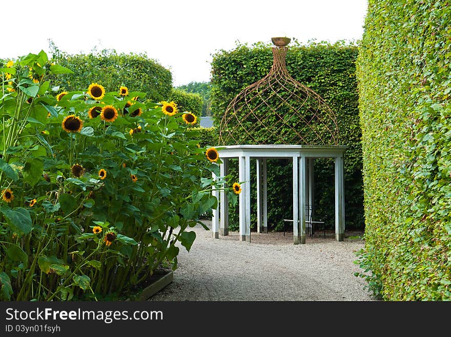 Beautiful decorative home garden yard gazebo pavilion made of wood and iron. Beautiful decorative home garden yard gazebo pavilion made of wood and iron