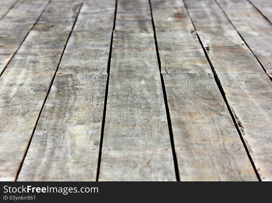 The old wooden floor for a walk inside the building