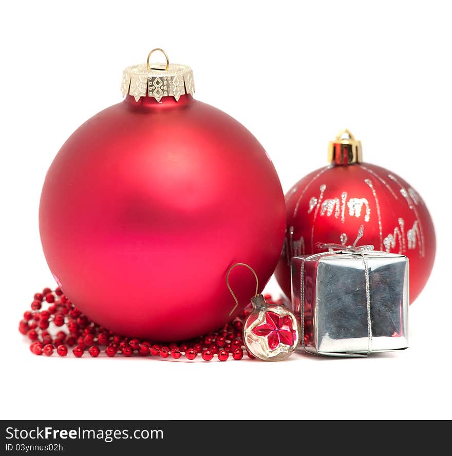 Three Christmas balls with red beads