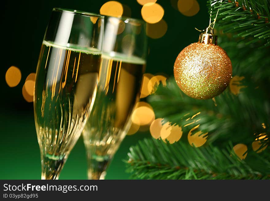 Festive champagne glasses with bokeh lights