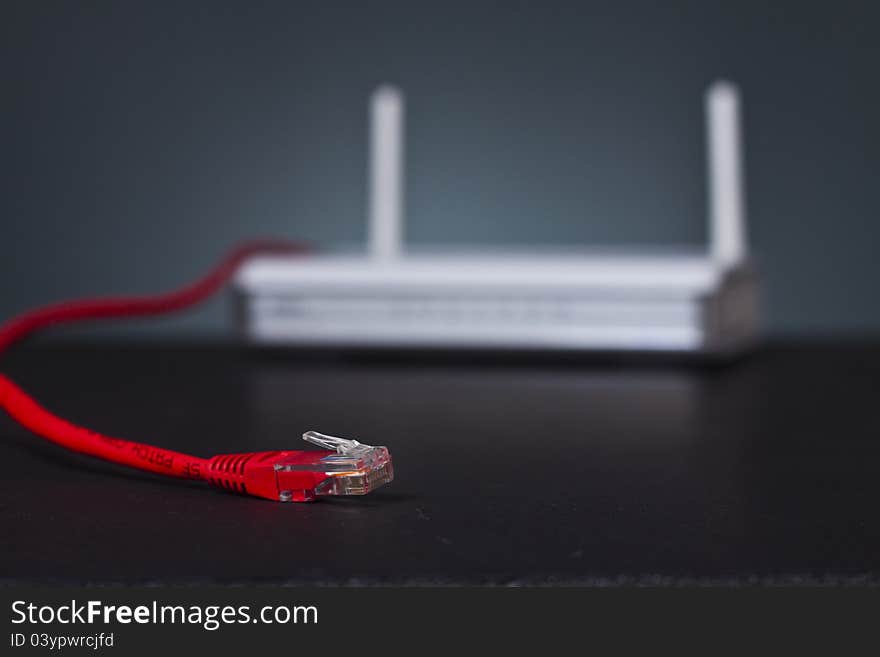 Ethernet cable coming from wireless router with double antenna