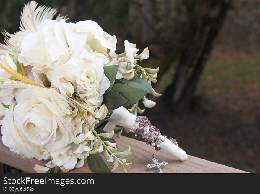 Feather and white rose bridal bouquet open space for wording or picture. Feather and white rose bridal bouquet open space for wording or picture