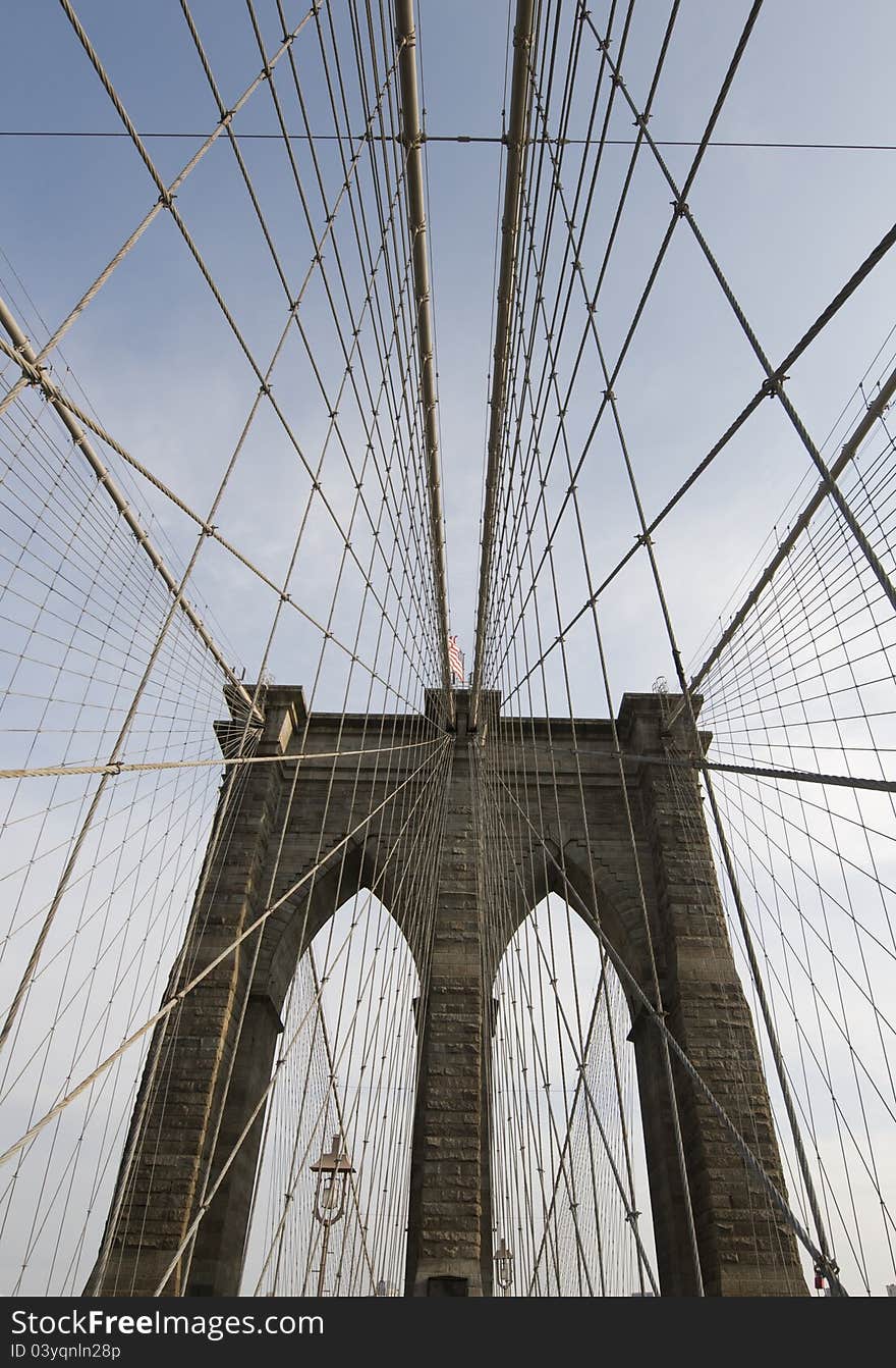 Vertical shot of suspension cables in Brooklyn Bridge exhibits intersting graphical patterns