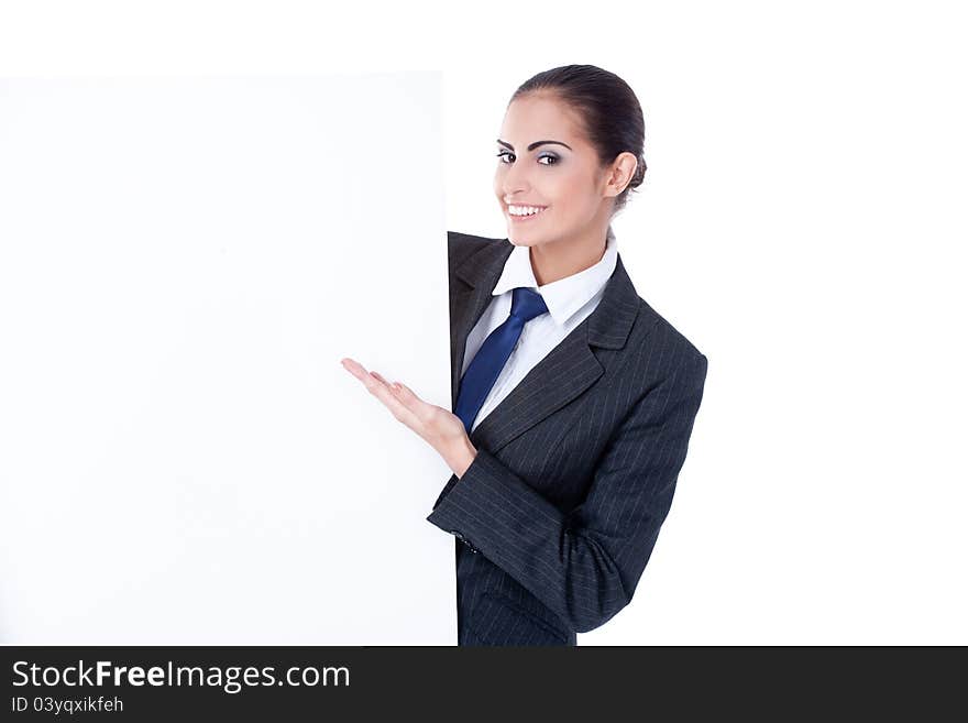 Young businesswoman pointing on copyspace on white background. Young businesswoman pointing on copyspace on white background