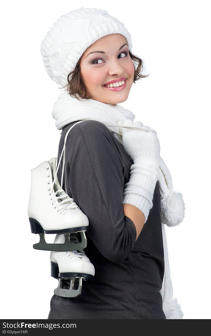 Pretty girl with figure skates on her shoulders