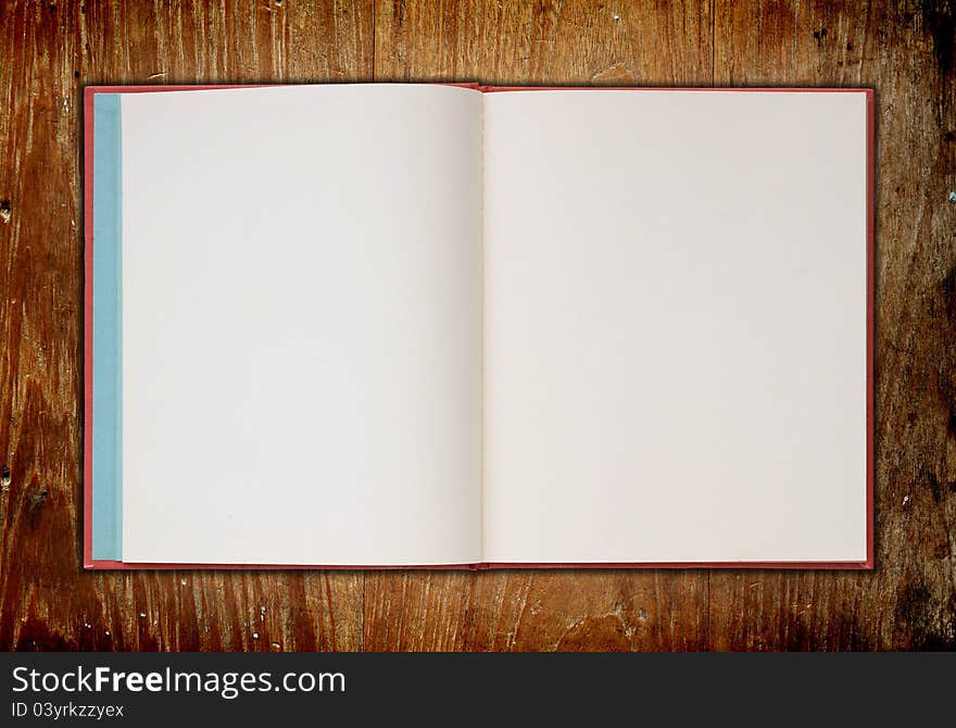 Book on old wooden background