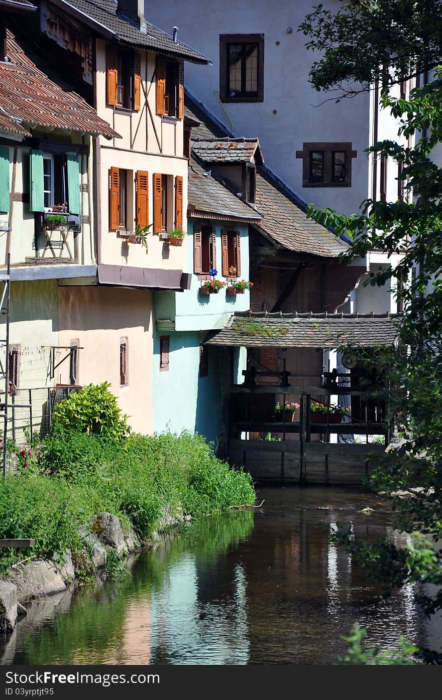 Riverside houses in a village in alsace on the french german border. Riverside houses in a village in alsace on the french german border