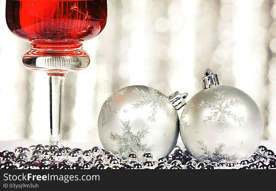 Red wine and christmas balls over abstract background. Red wine and christmas balls over abstract background