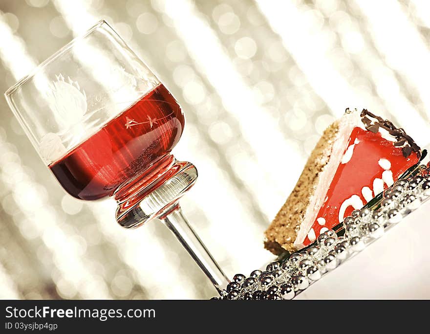 Red wine and cherry cake over abstract background. Red wine and cherry cake over abstract background