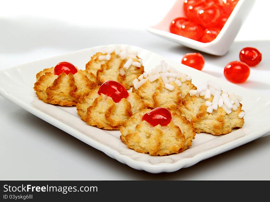 Sweet pastries whit sugar end cherris on white background. Sweet pastries whit sugar end cherris on white background