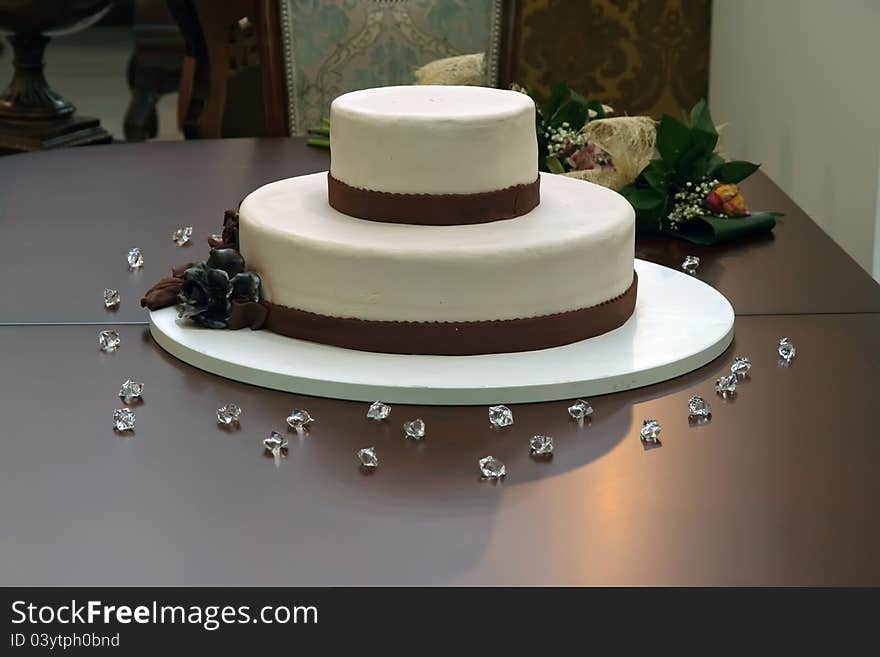 White and dark chocolate cake. Chocolate cake on a wooden table.