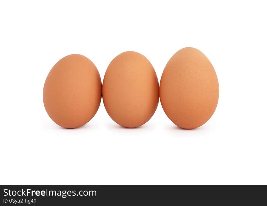 Three raw eggs on white background. Isolated with clipping path