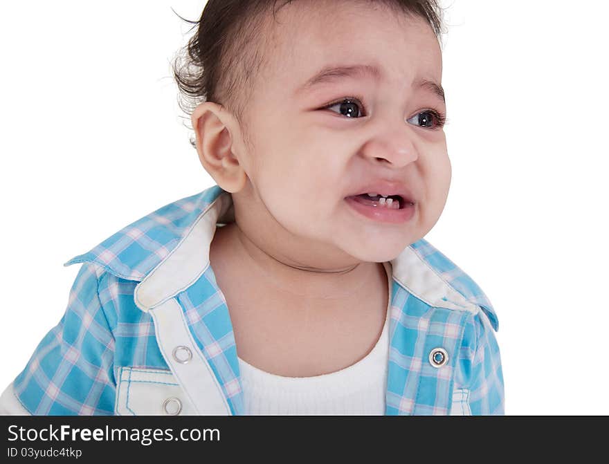 Adorable Indian baby crying a over white background