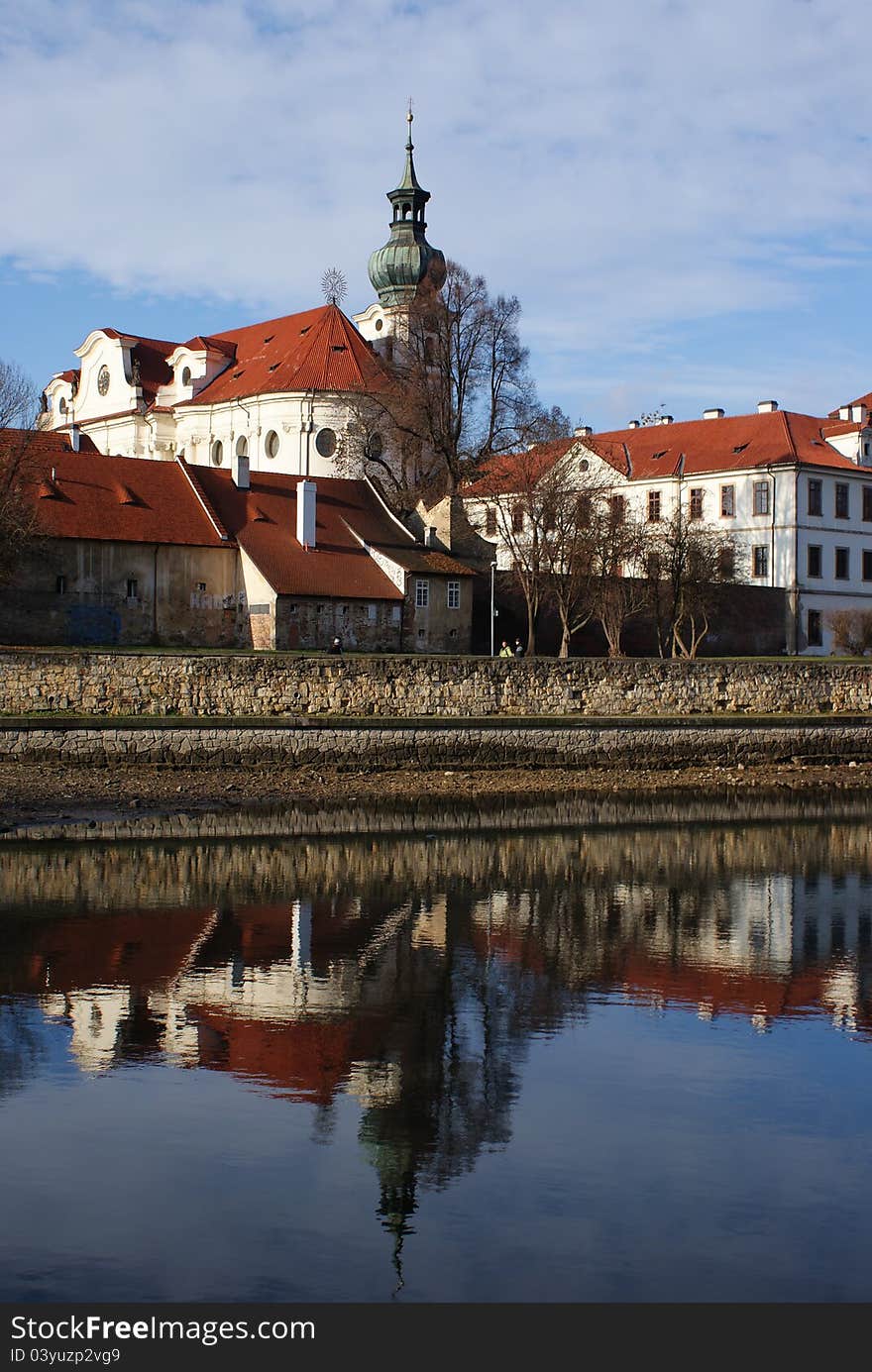 Brevnov monastery reflecting in water, Prague, Czech Republic