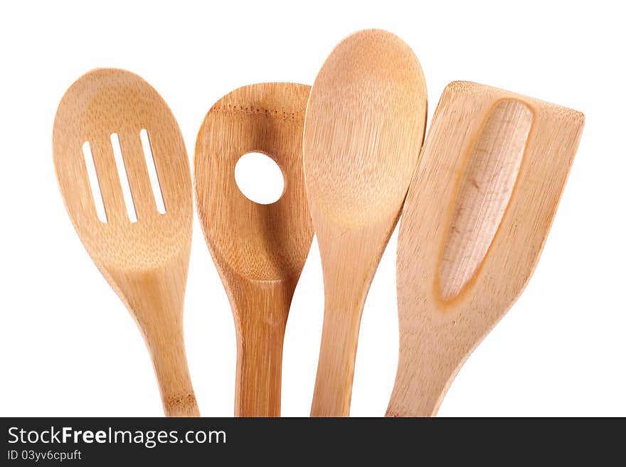 Wooden kitchen utensils isolated on white background