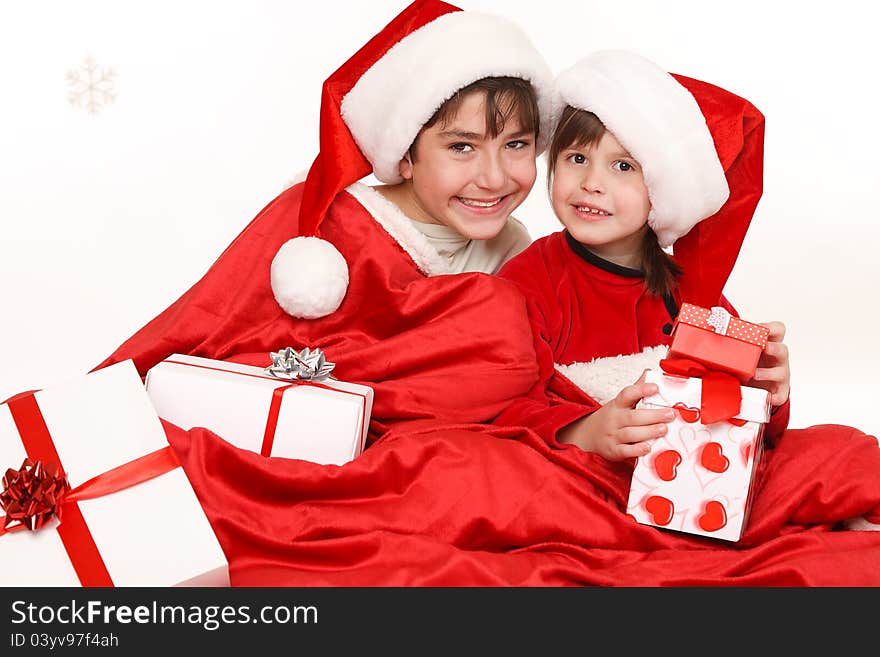 Brother and sister sitting with  gifts