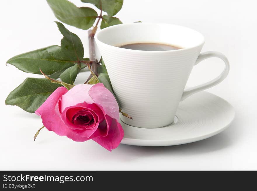 Bouquet of delicate pink roses in a cup on the table