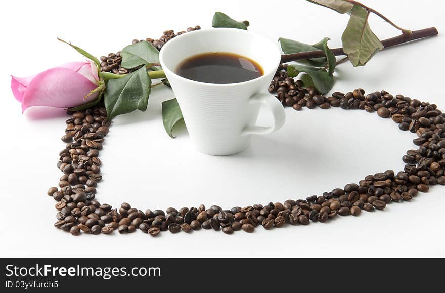 Cup of coffee, red roses and hearts