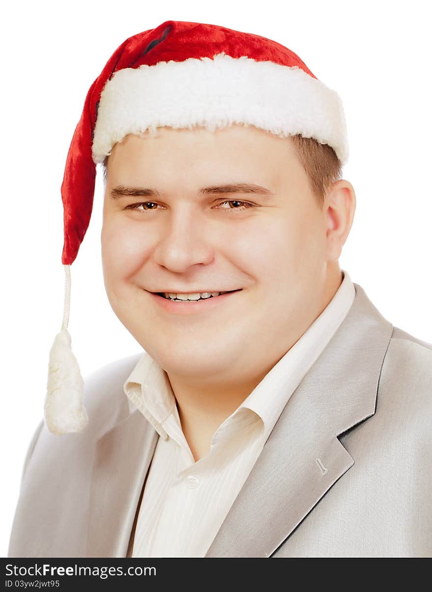 Young man in hat Santa Claus smiling at camera, isolated on white background. Young man in hat Santa Claus smiling at camera, isolated on white background.