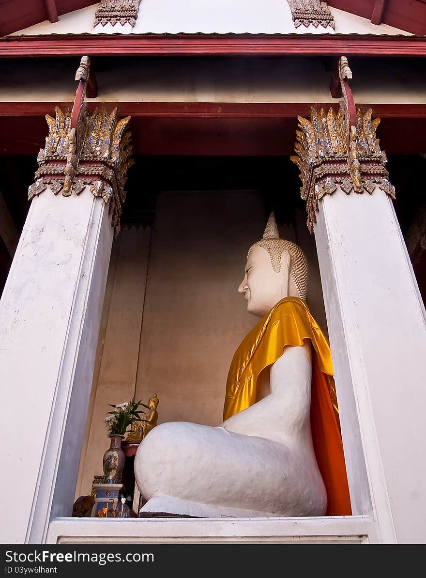 Old white buddha image in the temple , thailand