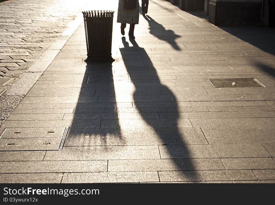 Sunset shot of two figures walking home. Sunset shot of two figures walking home.