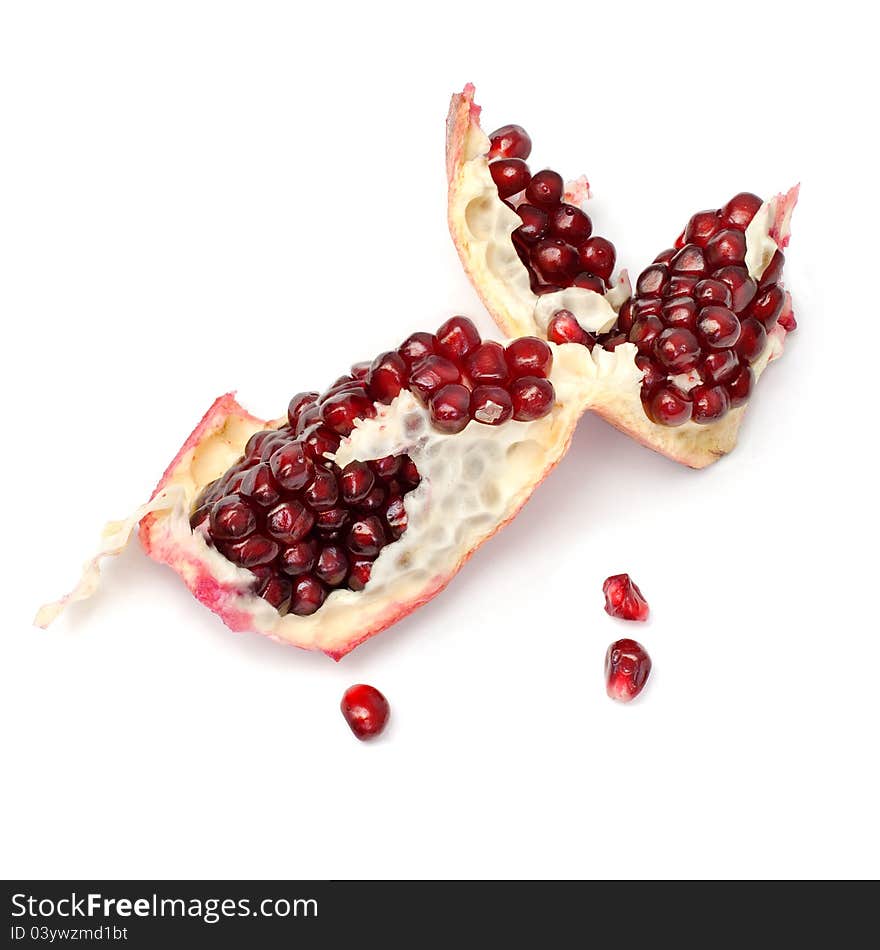 Piece of pomegranate on the white. Piece of pomegranate on the white