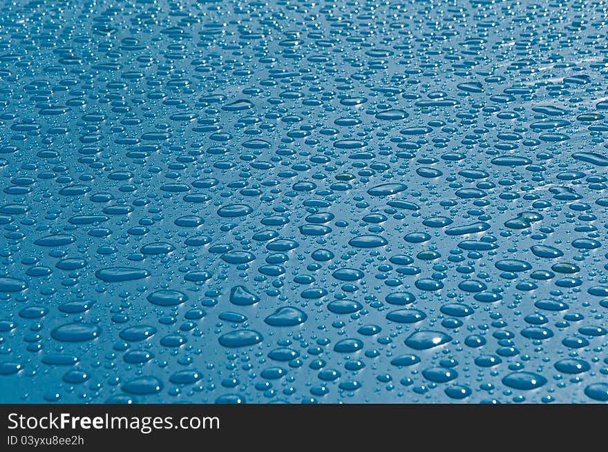 Rain drops on a dark blue background