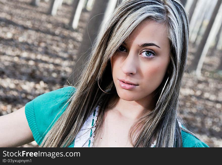 Beautiful blonde girl, dressed in green,  into the woods in Fuente Vaqueros, Granada, Andalusia, Spain. Beautiful blonde girl, dressed in green,  into the woods in Fuente Vaqueros, Granada, Andalusia, Spain