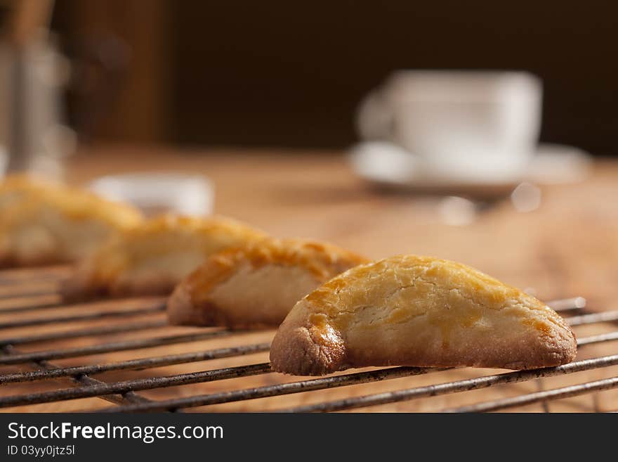 Warm, golden brown, pasty cooling on a rack. Shallow depth of field. Warm, golden brown, pasty cooling on a rack. Shallow depth of field.