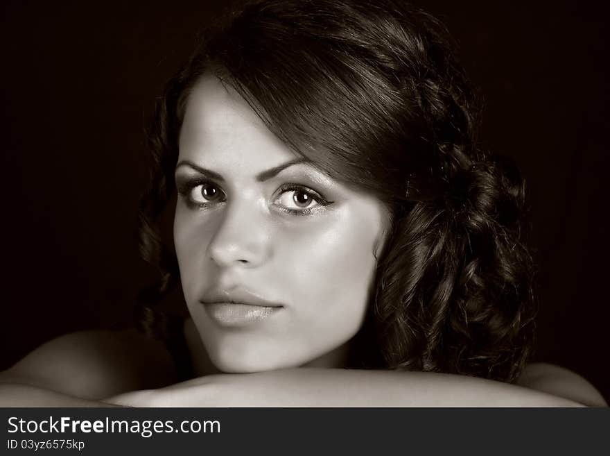 Portrait of a girl in front of black background