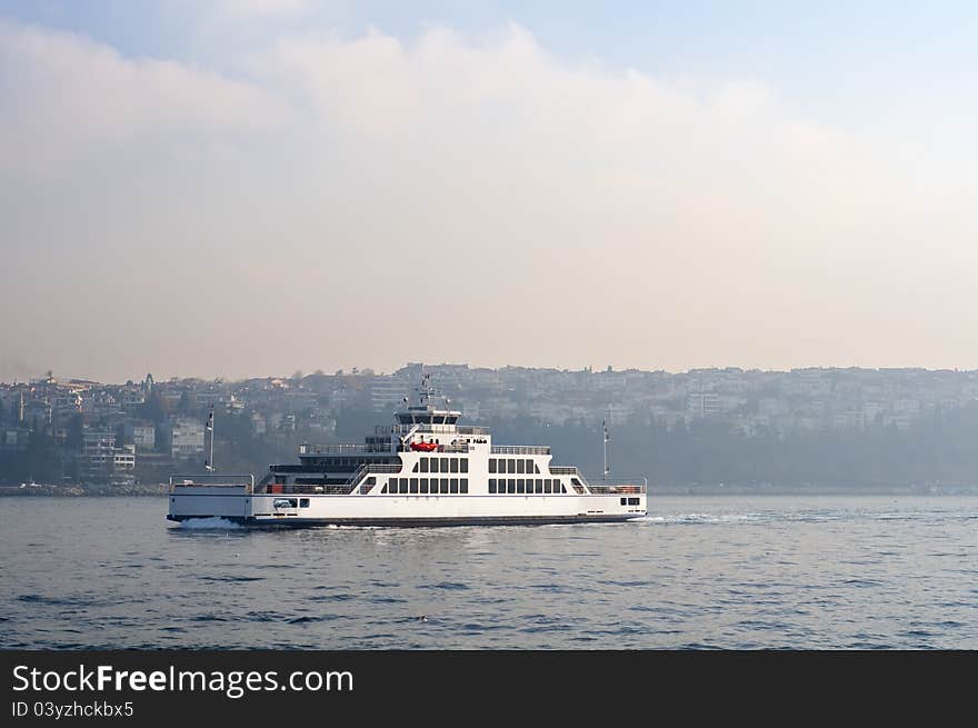 Photo of a ferry crossing Bosphorus. It's built for carrying cars through sea. Photo of a ferry crossing Bosphorus. It's built for carrying cars through sea.