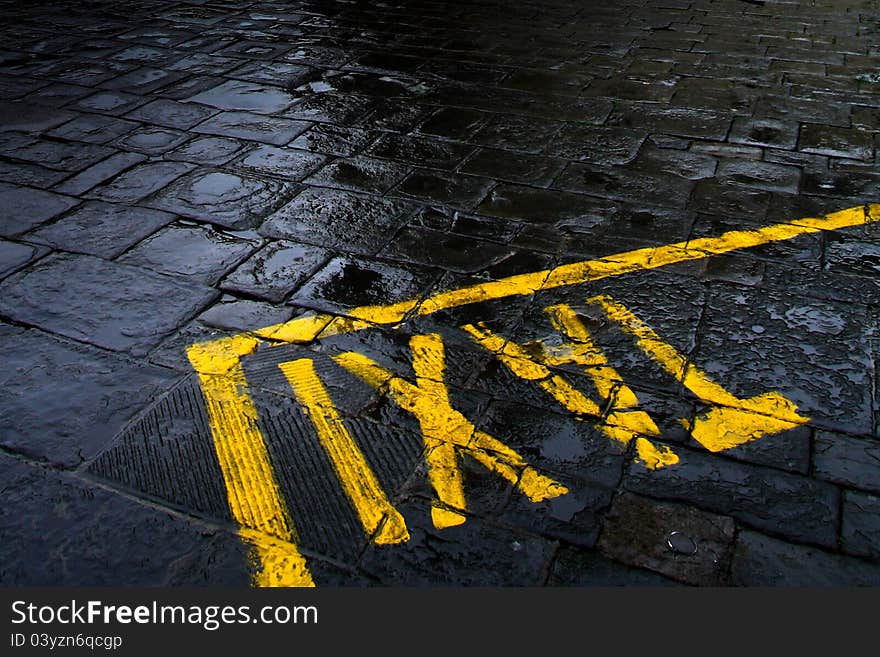 Taxi sign on rainy street